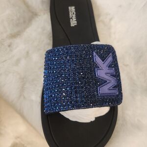 Brand new,  never worn size 7 Michael Kors slide